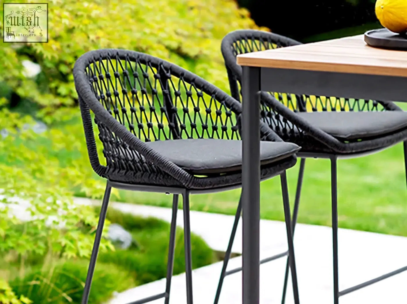 Black woven rattan barstool with cushioned seat and metal legs from dmitry outdoor garden table and outdoor garden table set