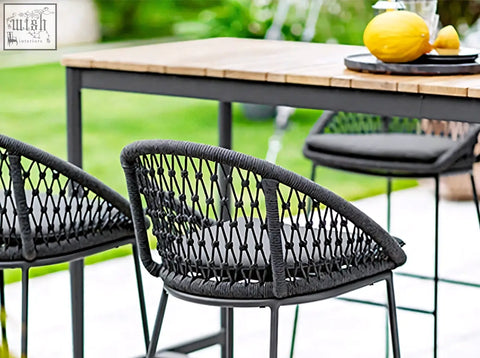 Black woven wicker bar stool with cushioned seat and metal frame from dmitry outdoor garden table set