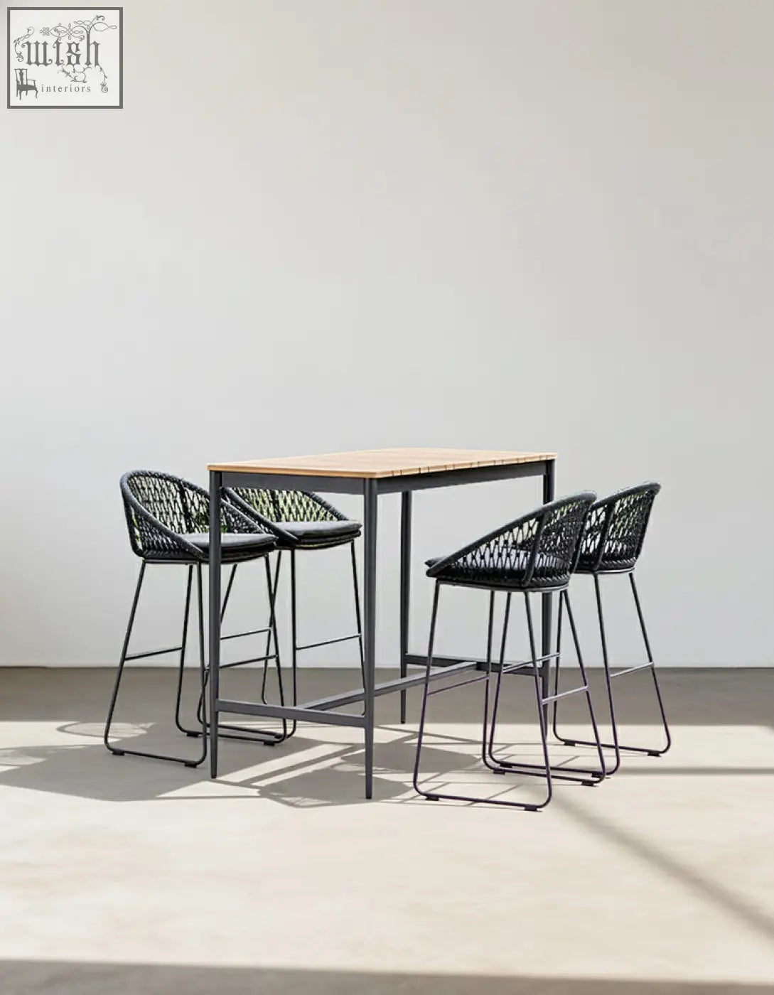 Modern black woven resin bar stools with metal legs and light wood tabletop in dmitry outdoor garden table set