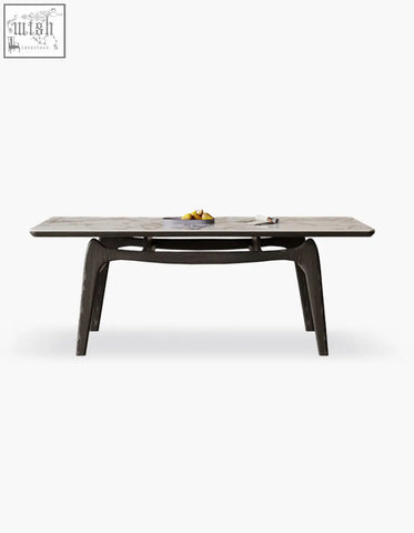 Modern dark wood dobson dining table with sleek sculpted legs and sintered stone top perfect for dining room use