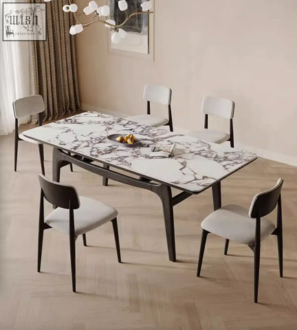 Dobson dining table with white sintered stone marble top and dark wood legs in a contemporary dining room setting