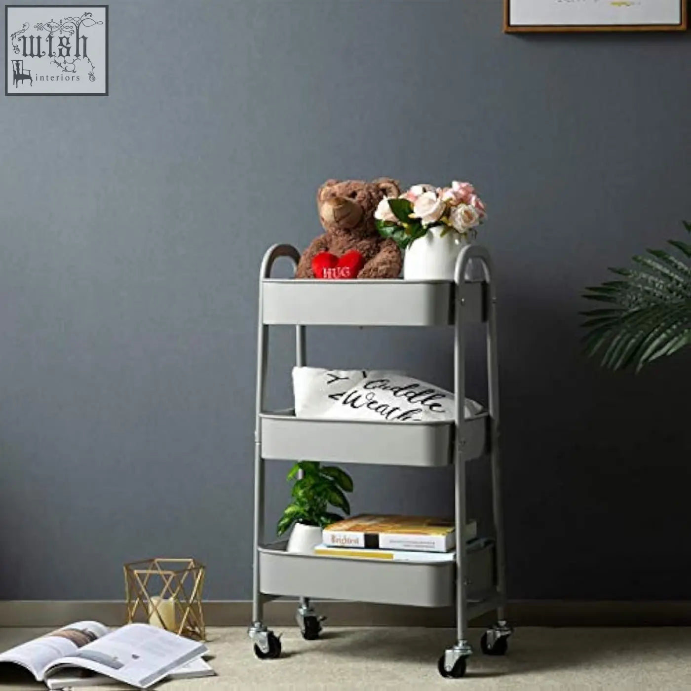 Gray metal doe works storage trolley 3 tier kitchen trolley and storage cart with wheels holding a teddy bear