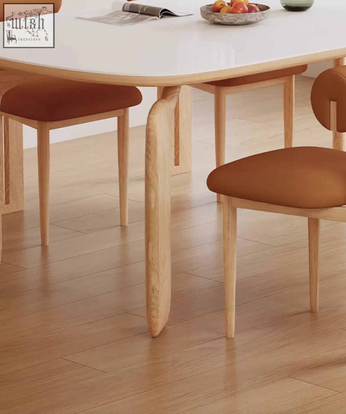 Light wood domingo dining table with curved legs and smooth white sintered stone surface for dining
