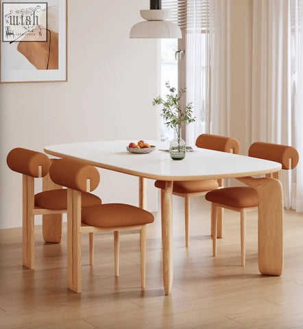 Modern domingo dining set with a sleek white sintered stone table and four brown leather chairs with curved backs