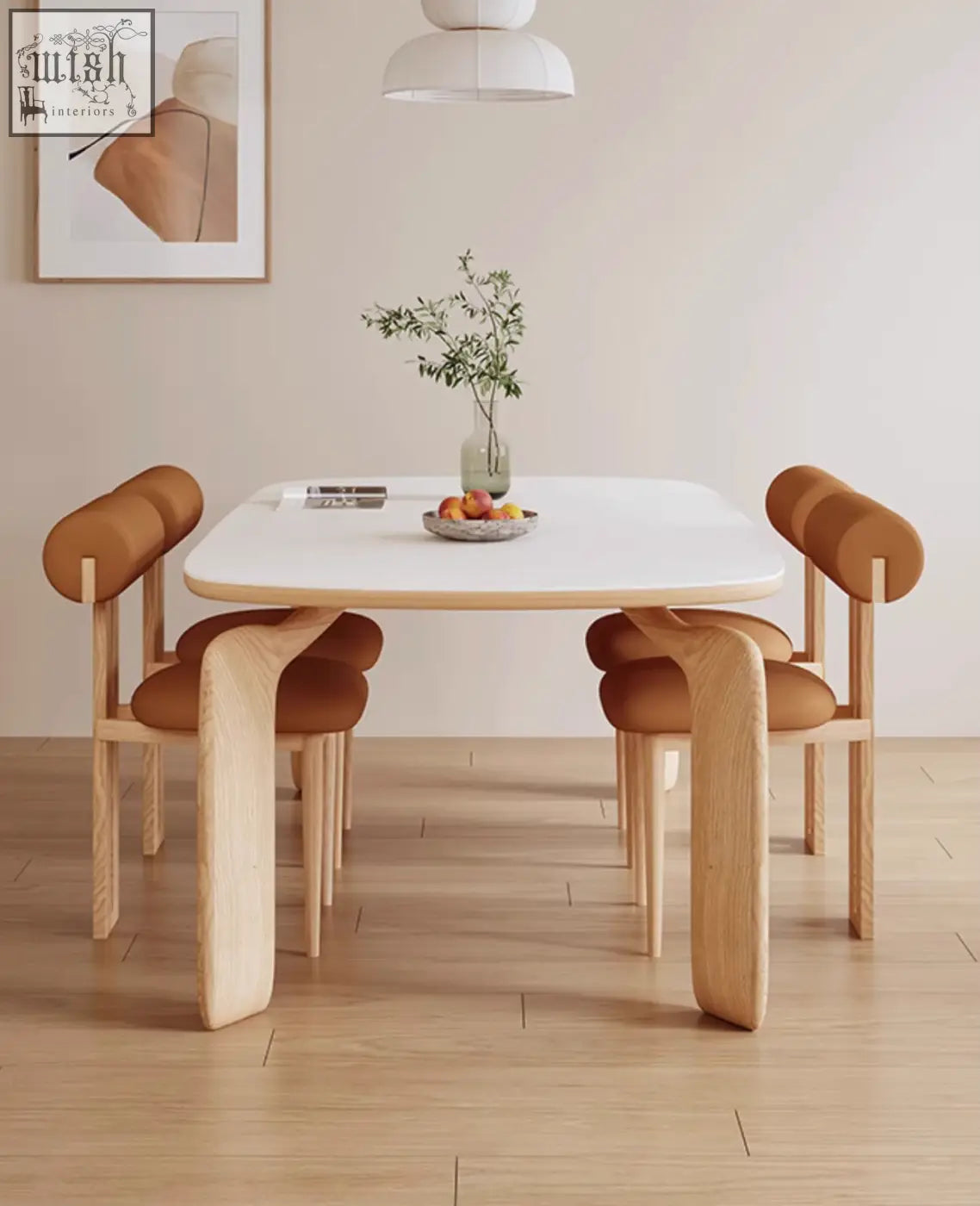 Modern domingo dining table with white sintered stone top and light wood legs paired with brown upholstered chairs