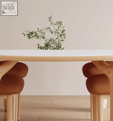 Modern domingo dining table with white sintered stone top and rounded cushioned brown wooden seats