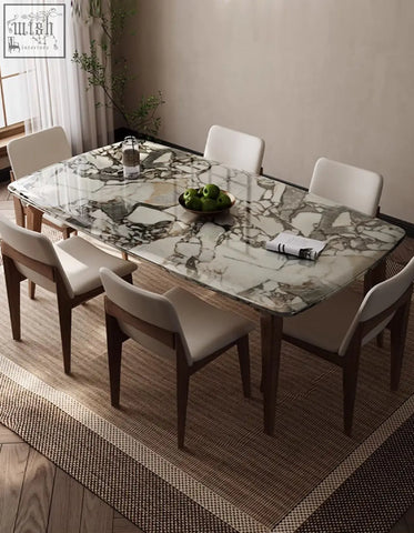 Dominic dining table featuring a marble top with natural gray and white veining perfect for any dining space