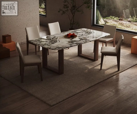Donovan dining table marble features a rectangular marble top with dark wood legs and light gray padded chairs for a modern table setup