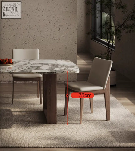 Modern dining chair with light beige upholstery and wooden legs perfect for the donovan dining table marble set