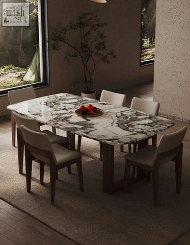 Donovan dining table with sleek white marble top featuring bold gray veins and dark wooden legs modern dining table