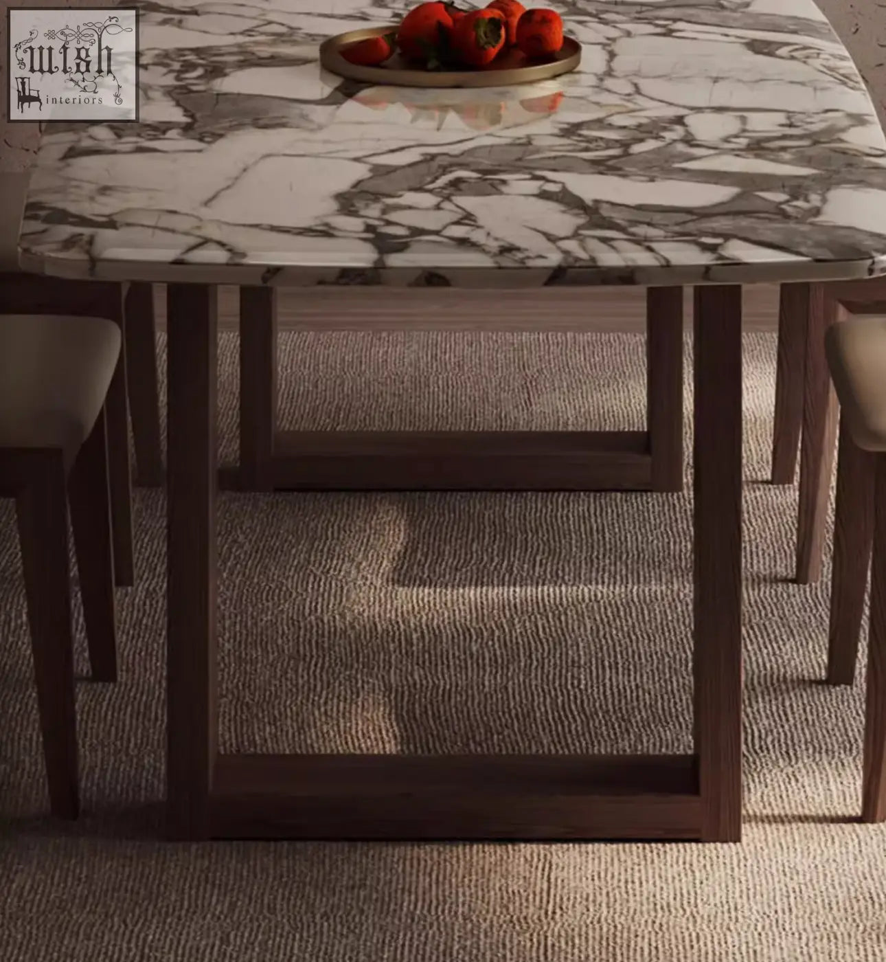 A sleek donovan dining table with a white and gray marble top and dark wood legs perfect for dining spaces