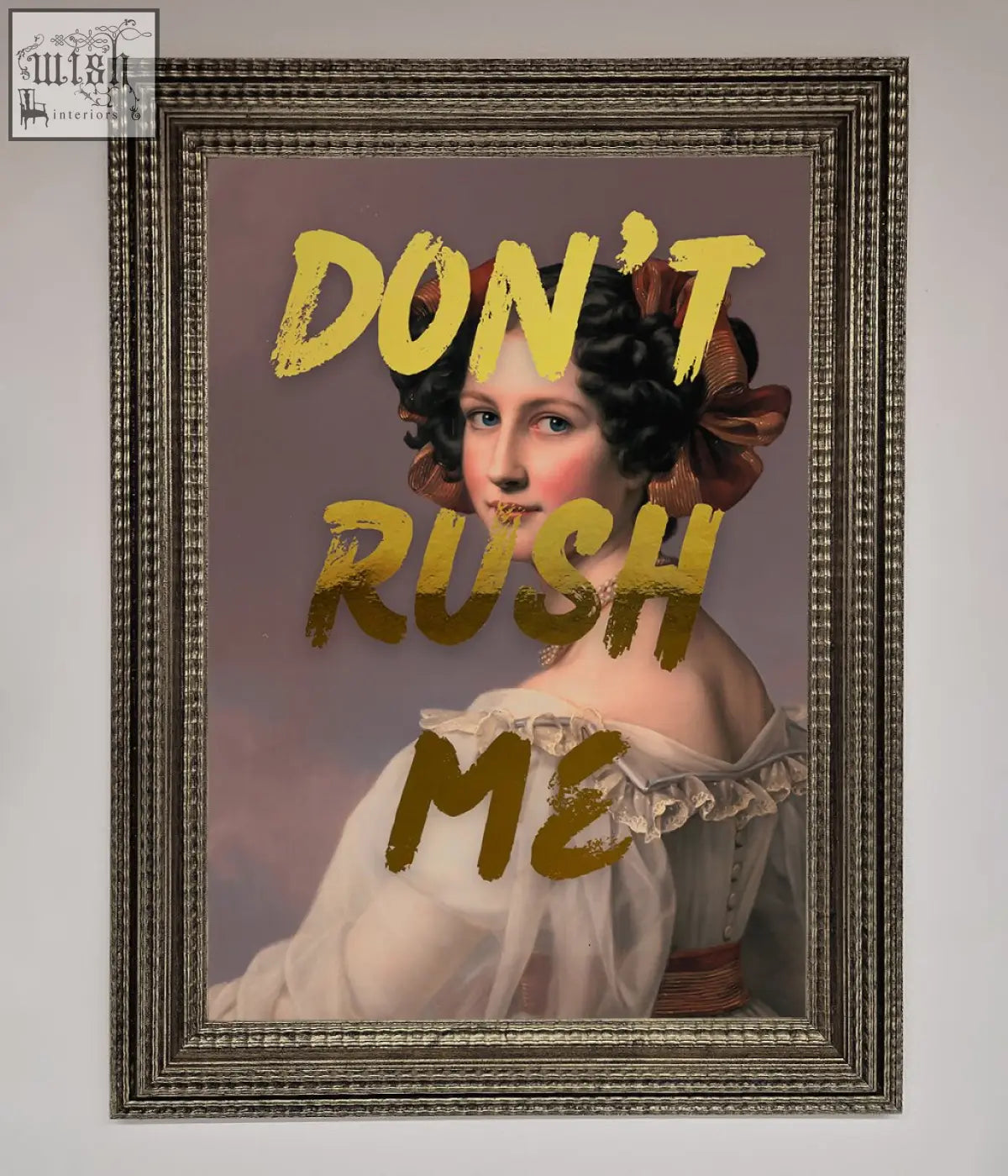 A dont rush foil print featuring a framed portrait of a woman in a white gown with gold lettering about shipping time