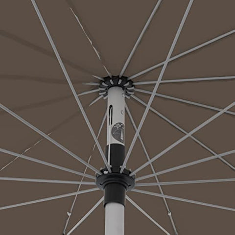 Close-up of doppler greige taupe crank umbrella with white aluminum pole and black accents in outdoor garden use