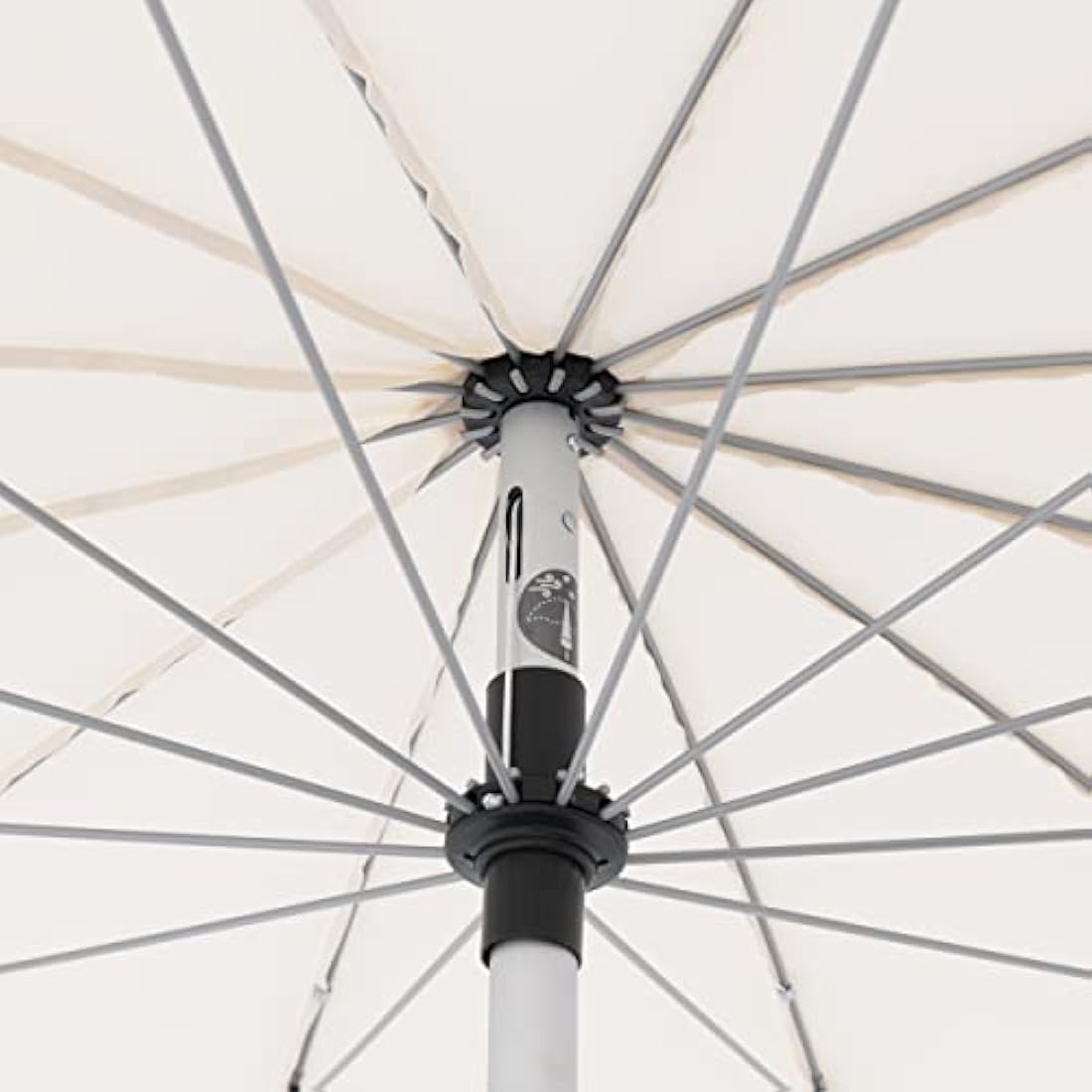 White fabric umbrella roof with silver ribs and black accents on central pole crank umbrella and real eye catcher