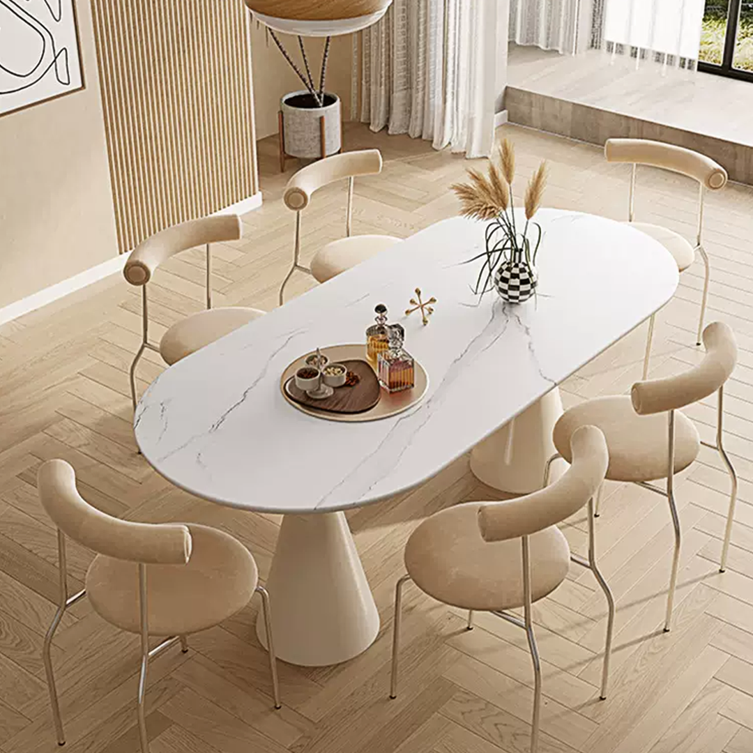White marble-effect oval doreen dining table with single pedestal base and minimalist design for dining room