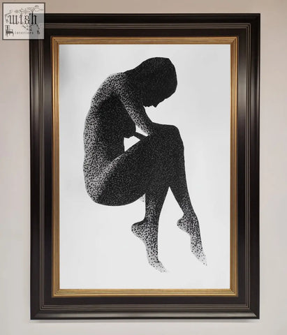 Black dotwork silhouette of seated figure in a dark brown frame with gold inner border in dotted figure framed poster