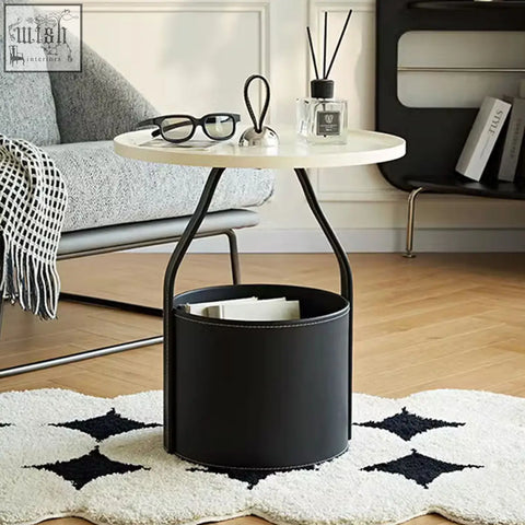 Black leather dottie portable side table with white sintered stone top and curved metal legs with storage basket