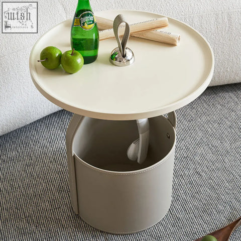 Cream-colored dottie portable side table with sleek sintered stone top and gray leather storage basket base