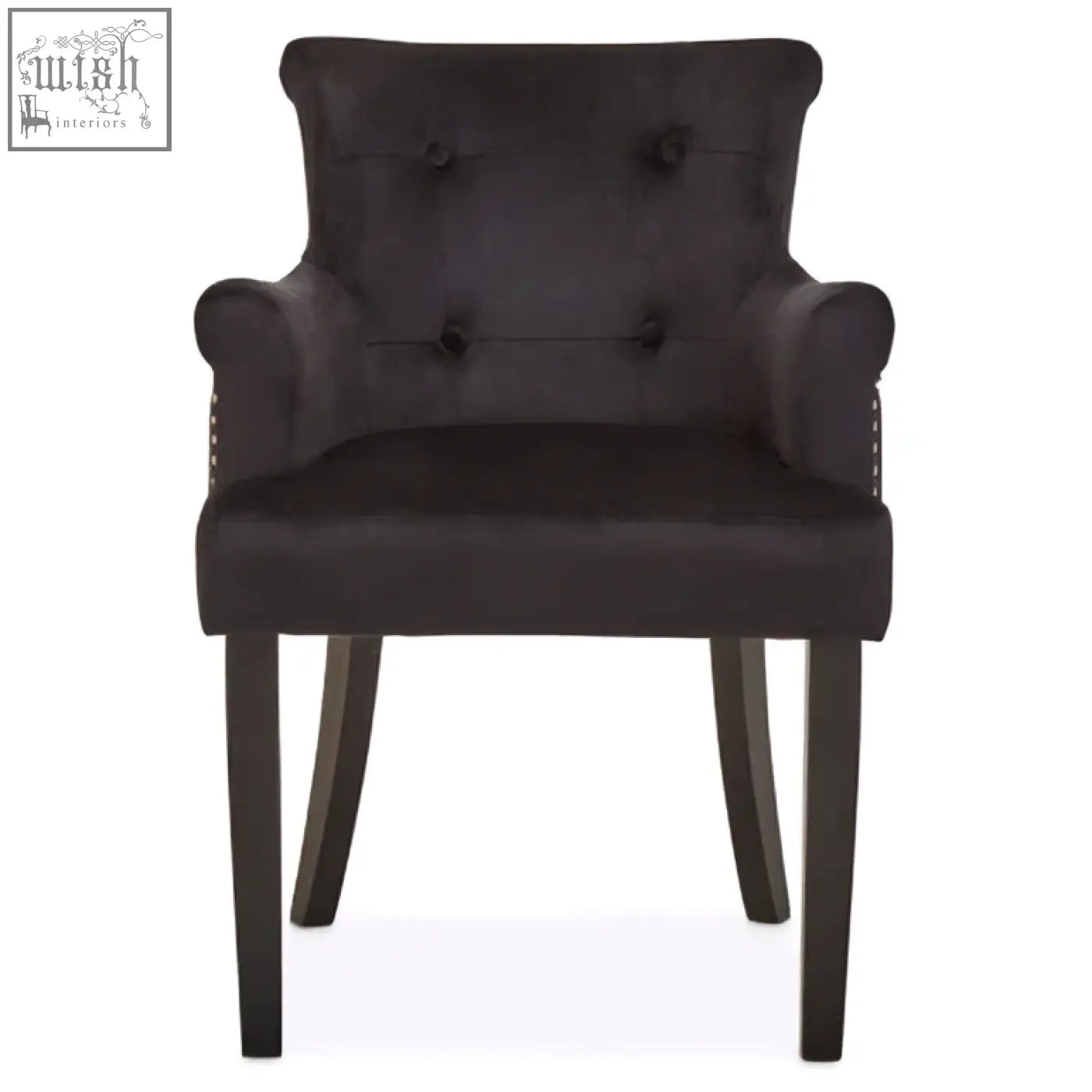 Dark gray velvet armchair with tufted back and rolled arms perfect for black velvet dining chair use