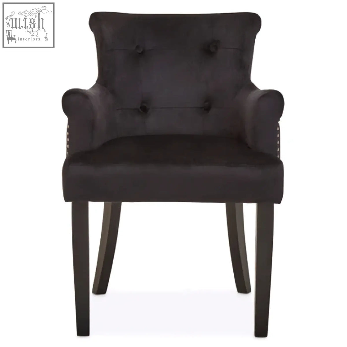 Dark gray velvet armchair with tufted back and rolled arms perfect for black velvet dining chair use