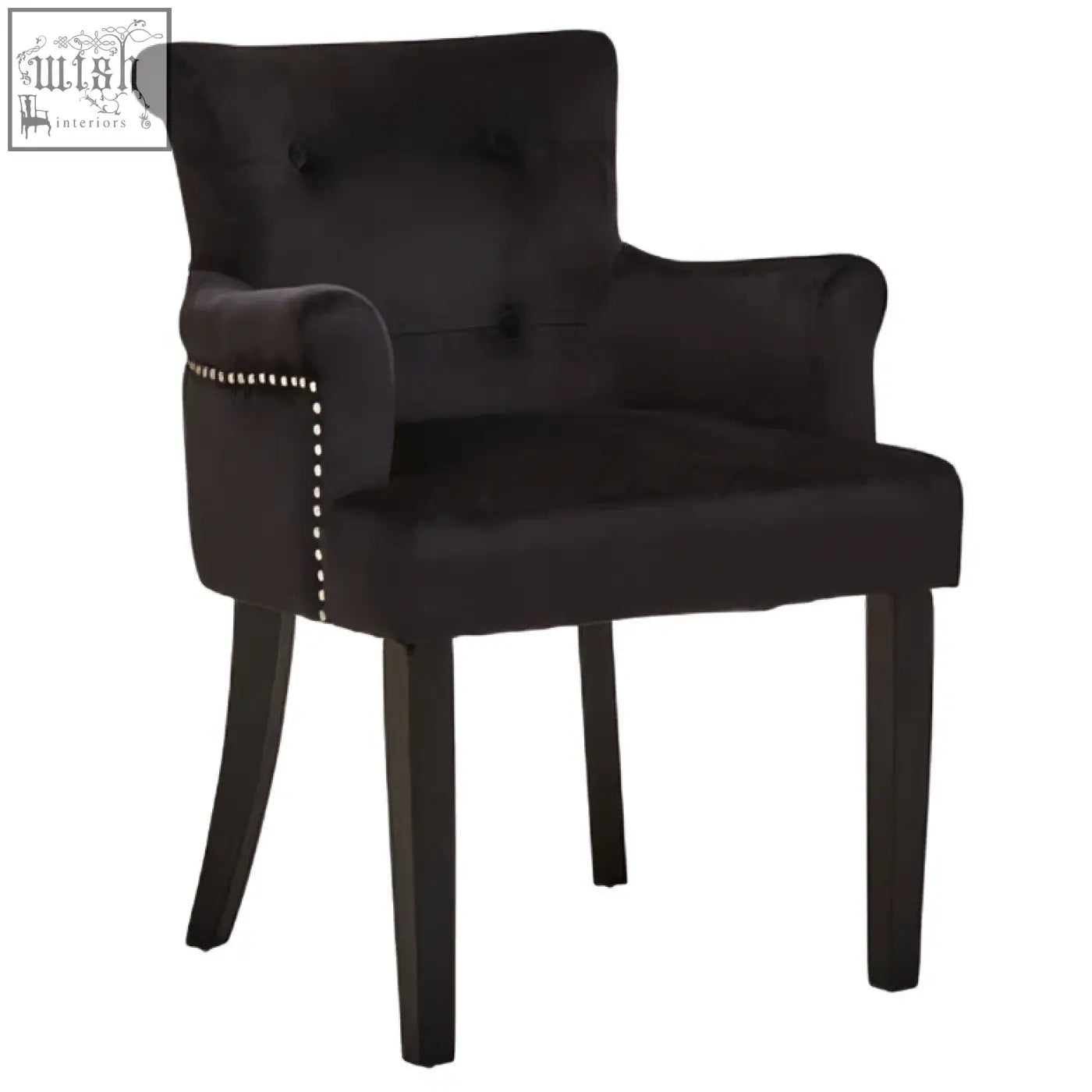 Black velvet dining chair with tufted back and silver nailhead trim perfect for elegant dining rooms