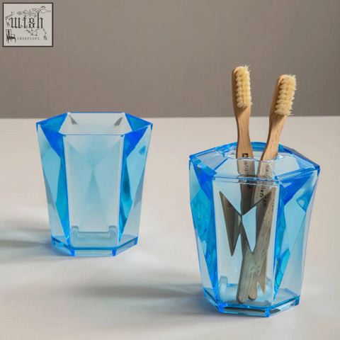 Dow blue acrylic tumbler in blue acrylic with tapered construction and faceted translucent geometric design