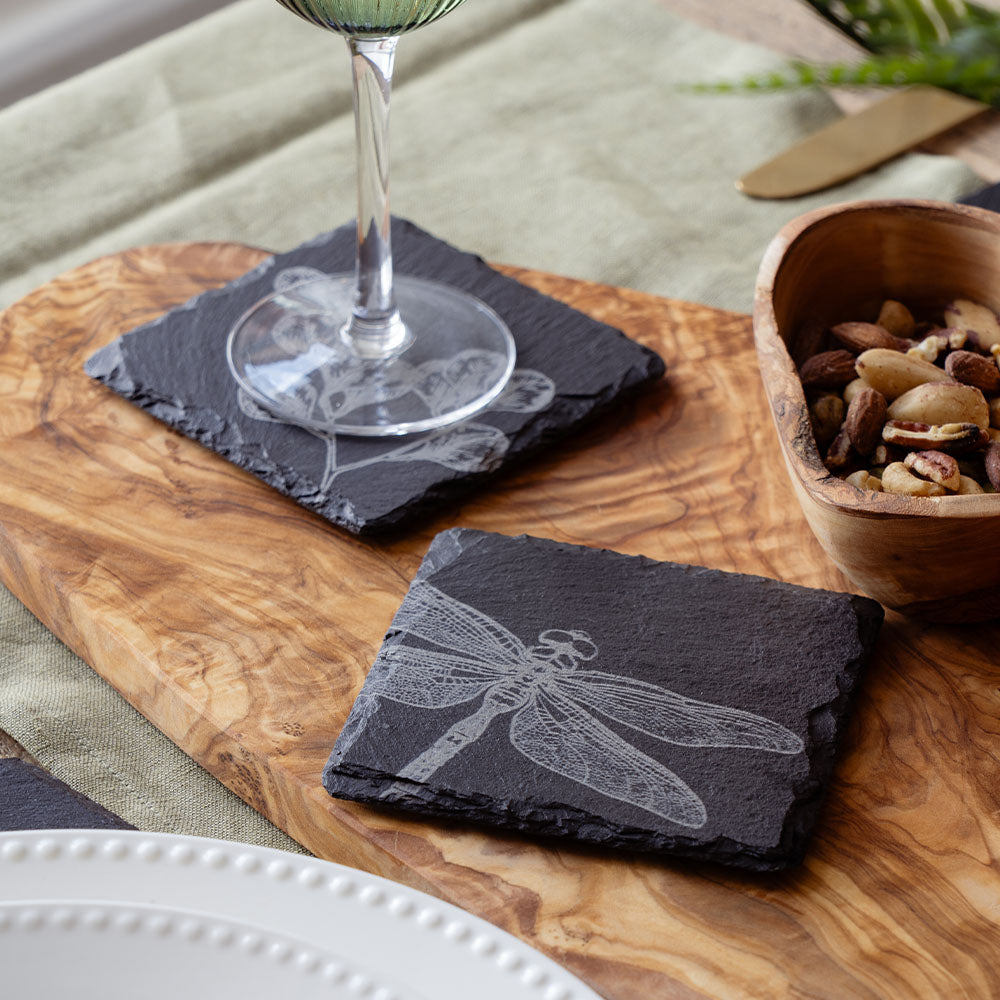 Dark gray slate coaster featuring an intricately etched dragonfly design in a single slate coaster style