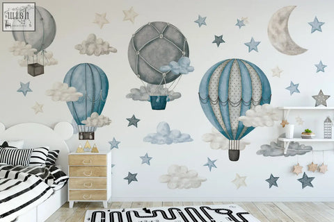 The dreamy hot air balloons and stars wall decals feature soft blue and gray whimsical nursery decor with clouds and stars