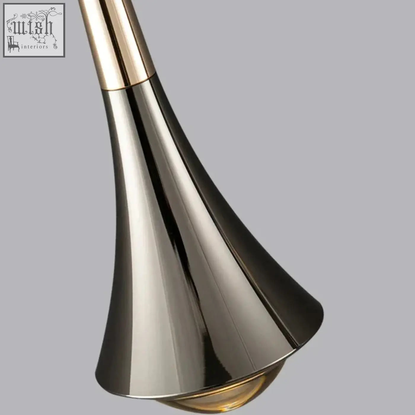 A sleek dropping pendant light with polished chrome finish gold accents and adjustable height warm led light