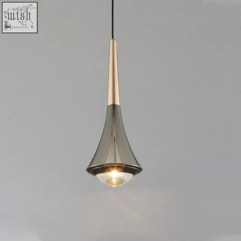 A sleek dropping pendant light with metallic gold and brushed silver finish and warm glowing led bulb