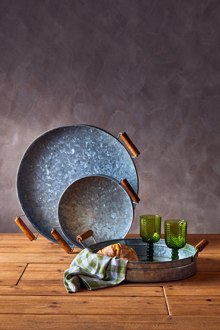 Set of three round galvanised steel trays with wooden handles featuring a rustic farmhouse design