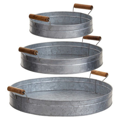 Set of three round galvanised steel trays with rustic wooden handles perfect for serving and decorating