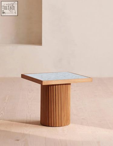 D’souza square side table with a solid wood fluted base and white marble top combines style and function shipping cost applies