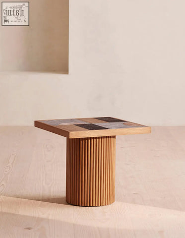 D’souza square side table combines solid wood fluted base with a mosaic top of wood marble and stone with low shipping cost