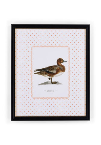 A framed print of a brown and white duck with detailed feathers on a pink polka dot background in a black frame