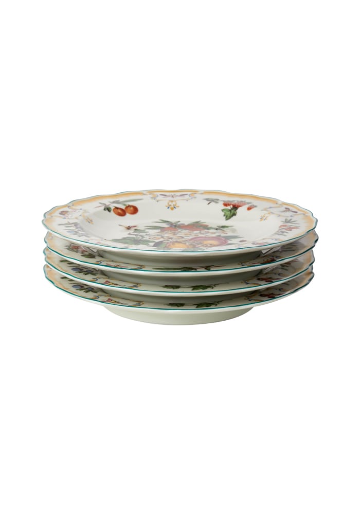 Stack of cream-colored duke of gloucester ceramic side plates with floral and fruit motifs and green trim