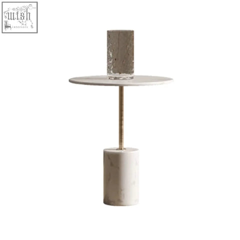 Minimalist dulcie side table with white marble base slender gold metal stem and textured gray cylindrical top