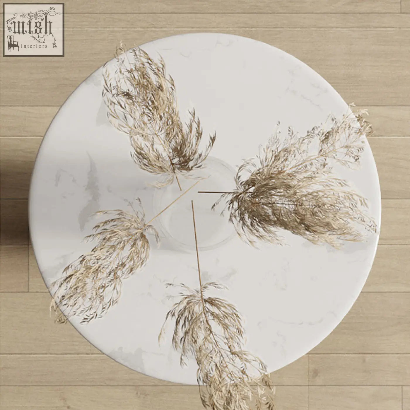 Dulcie side table marble with a round white marble top featuring gray veins and dried pampas grass decor in the center