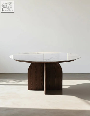 Modern round dunlap dining table with white sintered stone top and dark wood curved legs for stylish dining spaces
