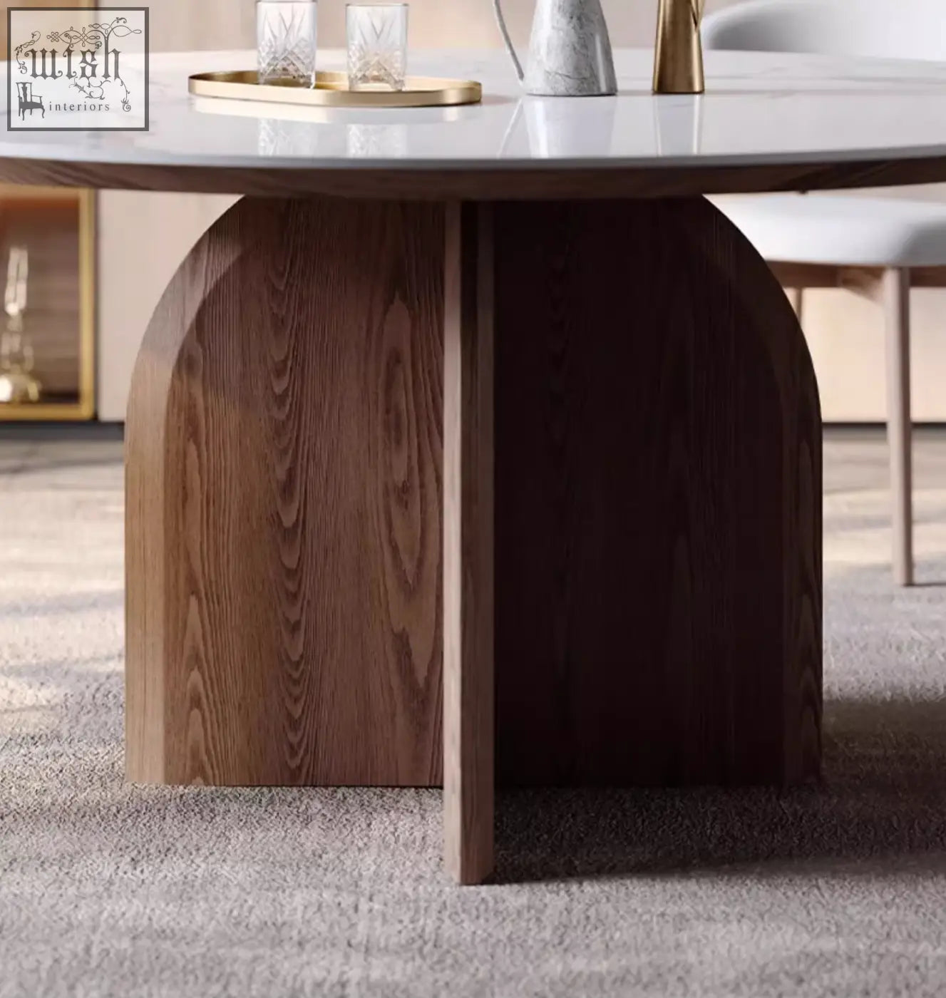 Modern dunlap dining table with sleek white sintered stone top and dark wood base featuring curved legs