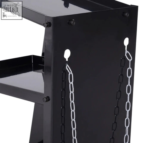 Black metal welding cart with four wheels and three shelves featuring black and silver hanging safety chains