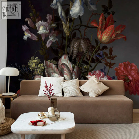 Brown velvet sofa with white and cream pillows in living space featuring dutch dark classic floral peel and stick wallpaper by contact clickwalls