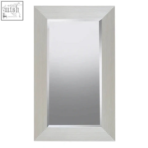 Silver wall mirror with champagne silver frame and vertical ridged bevelled edge from duvali collection