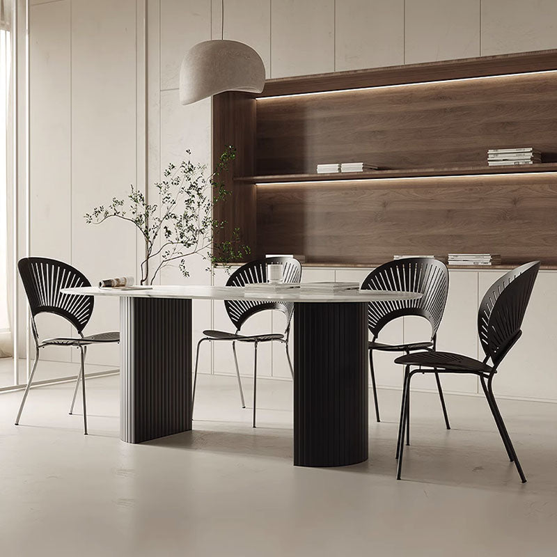 Modern black metal dwight dining table with sleek ribbed legs and smooth white marble top perfect for dining rooms