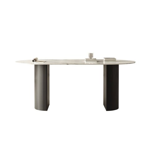 Modern oval dwight dining table with white marble top and contrasting silver and black fluted legs on minimalist supports