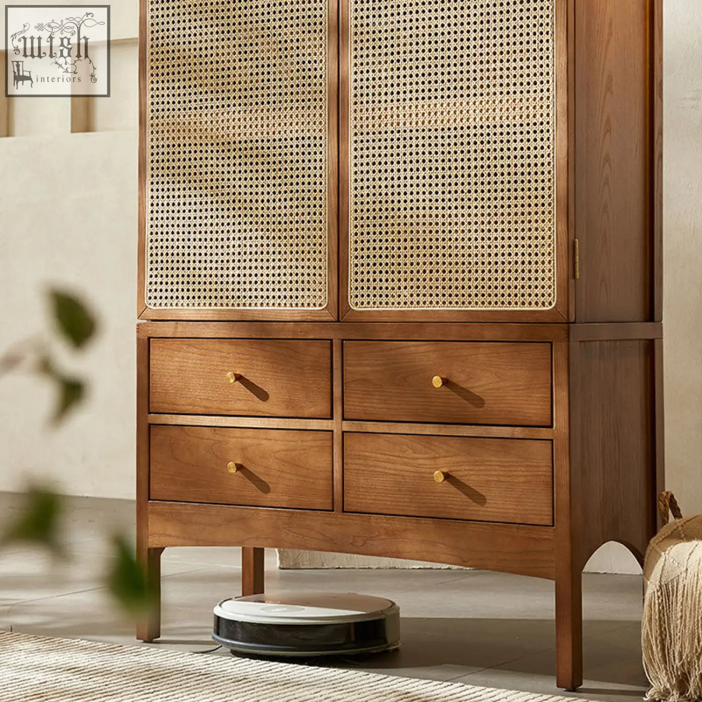 A warm-toned wooden dylan rattan wardrobe with cane panel doors and four drawers with brass handles