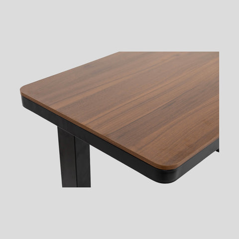 Modern wooden e-max electric height adjustable desk with black metal frame and walnut wood top featuring charging port