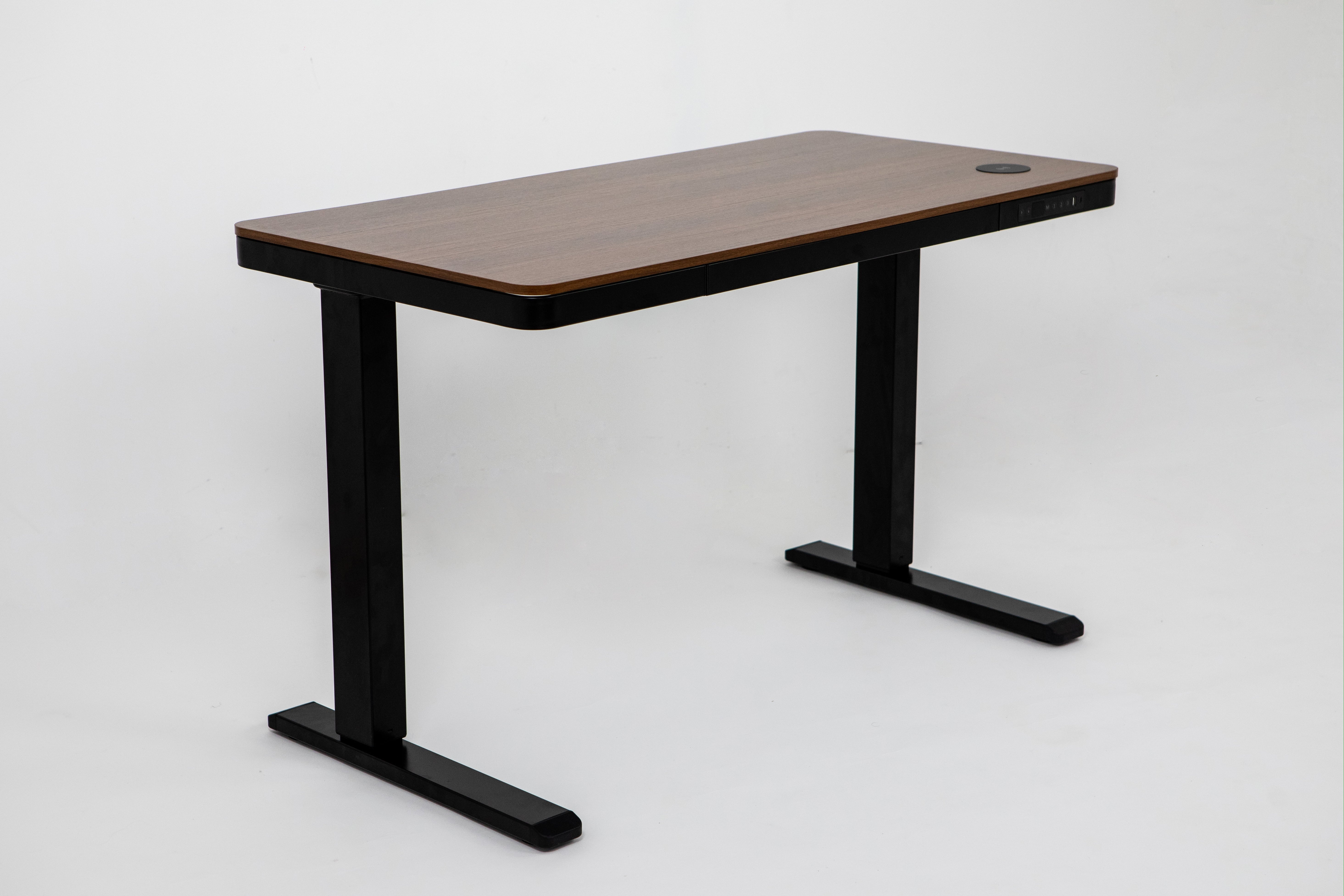 E-max electric height adjustable desk with sleek walnut wood top, black metal legs, and built-in charging port