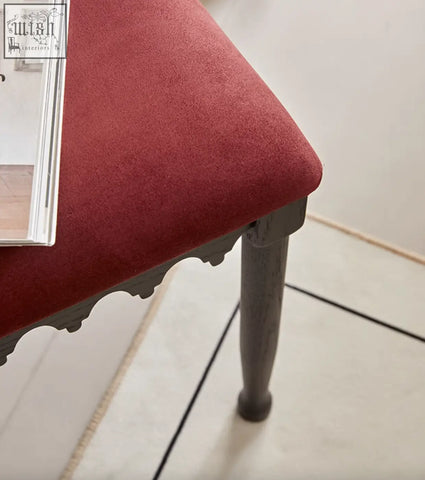 A plush red upholstered ealing high-back dining chair stool with dark gray carved legs perfect for dining areas