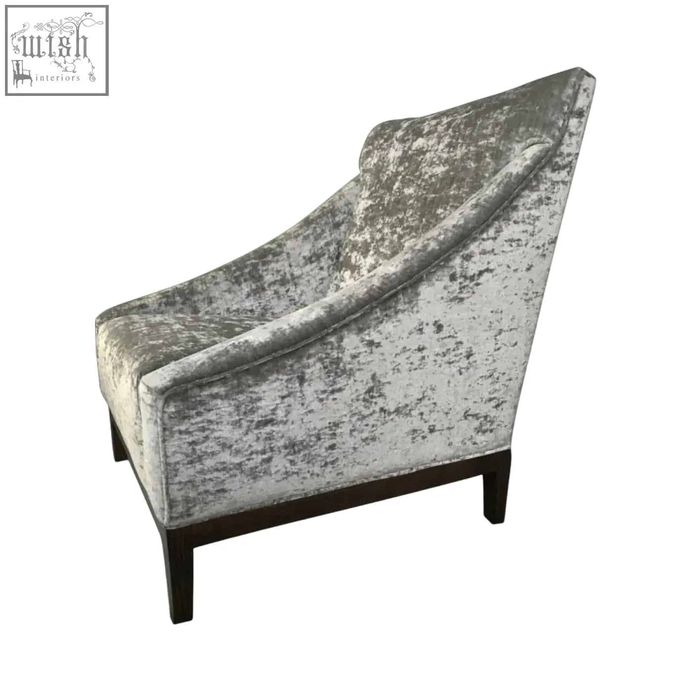 Silver-gray distressed velvet ease arm chair with dark wood legs and comfy cushioning for stylish seating